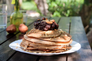 Homemade pancakes with chocolate and nuts for lunch